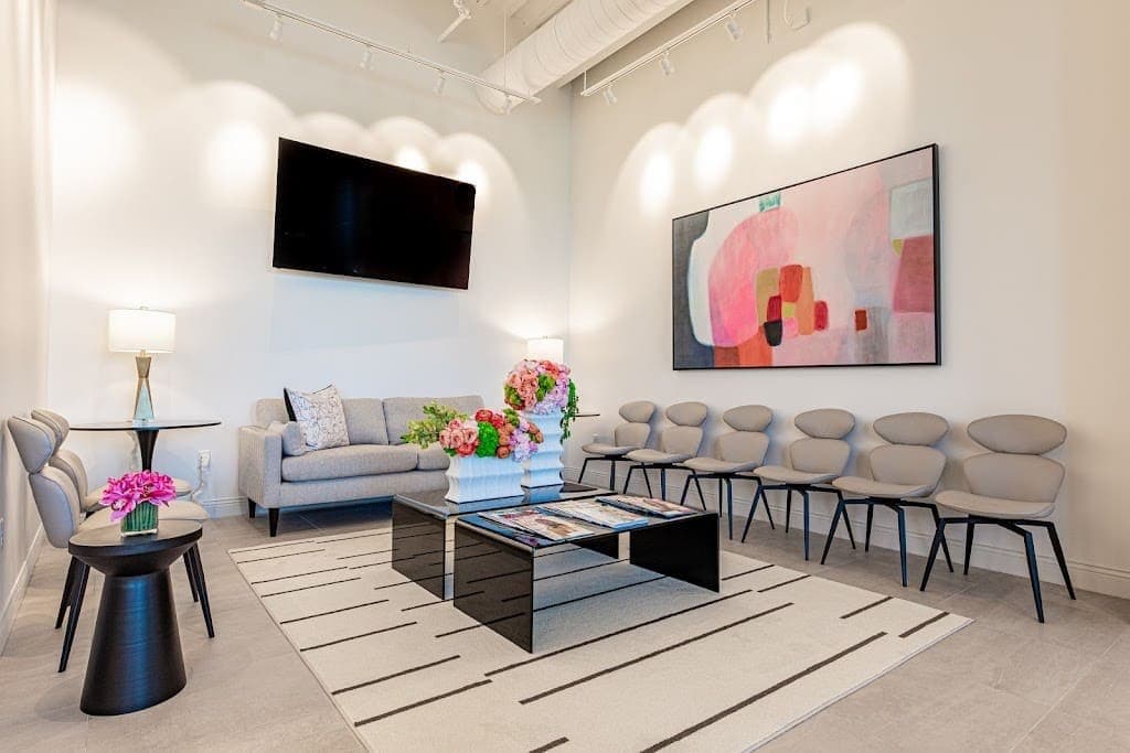 Medspa waiting room with a wall-mounted screen
